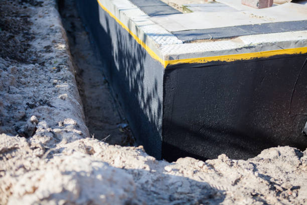 Professional Emergency Waterproofing technician working in Eaton Rapids, MI